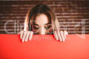 Woman looking at blank sheet