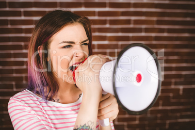 Woman shouting on megaphone