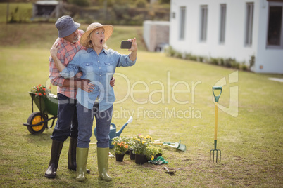 Senior couple taking selfie from mobile phone