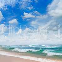 ocean, sandy beach and blue sky