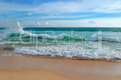 ocean, sandy beach and blue sky