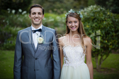 Wedding couple standing together in garden