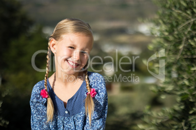 Girl smiling at camera on a sunny day