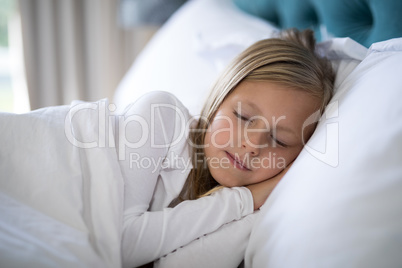 Girl sleeping on bed in bedroom