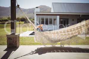 Senior woman relaxing on hammock