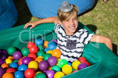 Portrait of smiling boy in ball pool