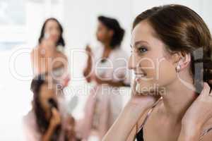 Smiling bride getting ready