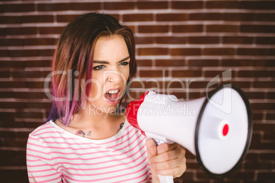 Woman shouting on megaphone