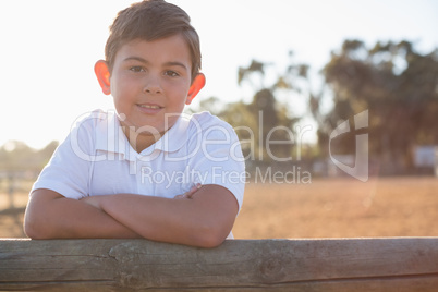 Boy smiling at camera in the ranch