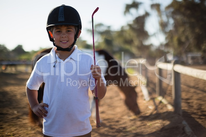 Smiling boy in the ranch on a sunny day