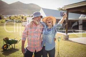 Senior couple taking selfie from mobile phone