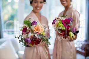 Happy brides holding bouquet