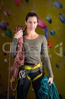 Happy woman with rope in fitness studio