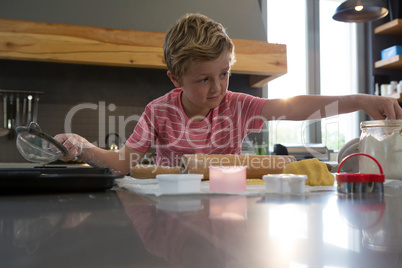 Boy preparing cookies