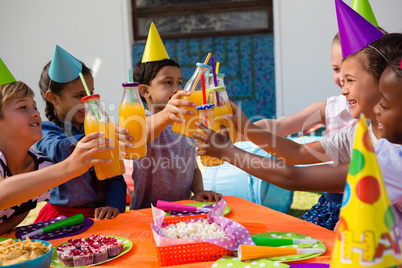 Children toasting drinking bottles