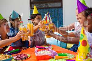 Children toasting drinking bottles