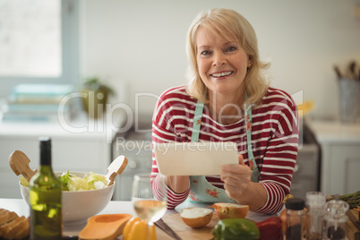 Senior woman using digital tablet