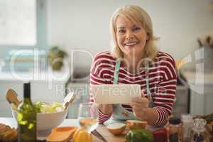 Senior woman using digital tablet