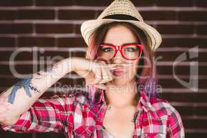 Beautiful woman pretending to have a fake moustache