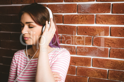 Woman listening music on headphones