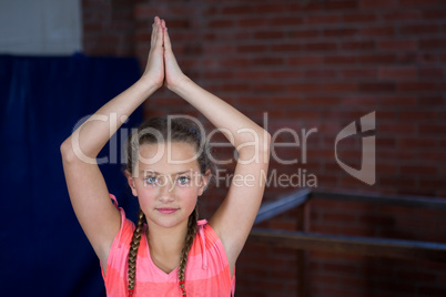 Portrait of teenage girl practicing yoga