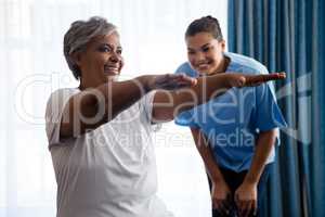Nurse training woman in nursing home