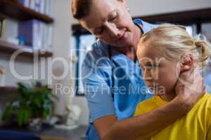 Female doctor examining a little girl