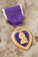 Purple Heart Medal Laying on Military Fatigues