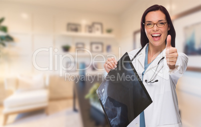 Young Female Doctor or Nurse with Thumbs Up Standing in Office H