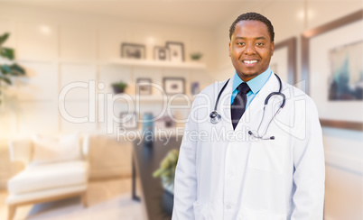 Young African American Doctor or Nurse Standing in His Office