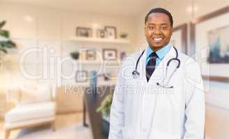 Young African American Doctor or Nurse Standing in His Office