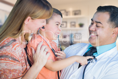 Young Boy and Mother Visiting with Hispanic Doctor in Office