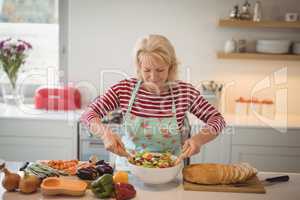 Senior woman preparing meal