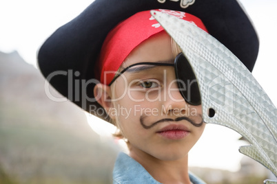 Close up portrait of boy wearing pirates costume