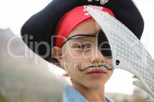 Close up portrait of boy wearing pirates costume