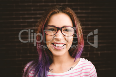 Portrait of smiling woman in spectacles