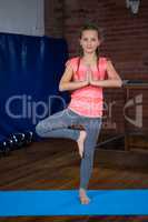 Portrait of teenage girl practicing yoga