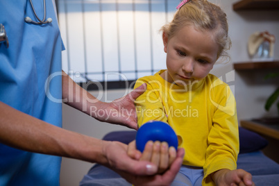 Female doctor examining a little girl