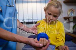 Female doctor examining a little girl