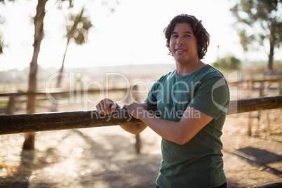 Man smiling at camera in the ranch