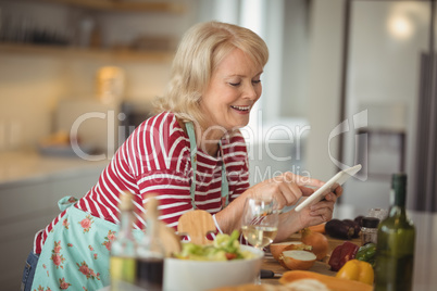 Senior woman using digital tablet