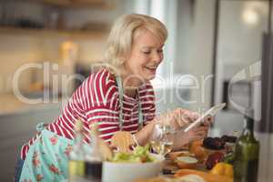 Senior woman using digital tablet