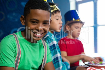 Portrait of smiling boy with friends