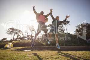 Father and son jumping in the park