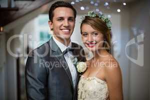 Wedding couple standing together in hall