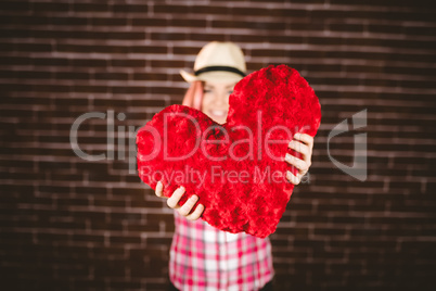 Smiling woman showing heart shape