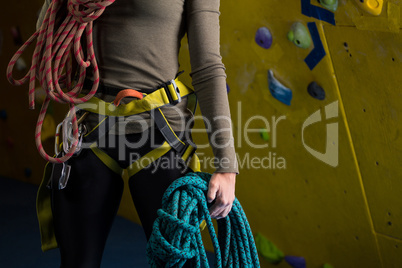 Woman with rope in fitness studio