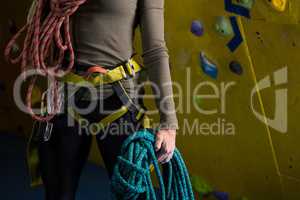Woman with rope in fitness studio