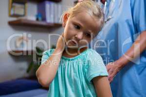 Female doctor examining a little girl