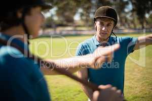 Tow male jockey talking to each other